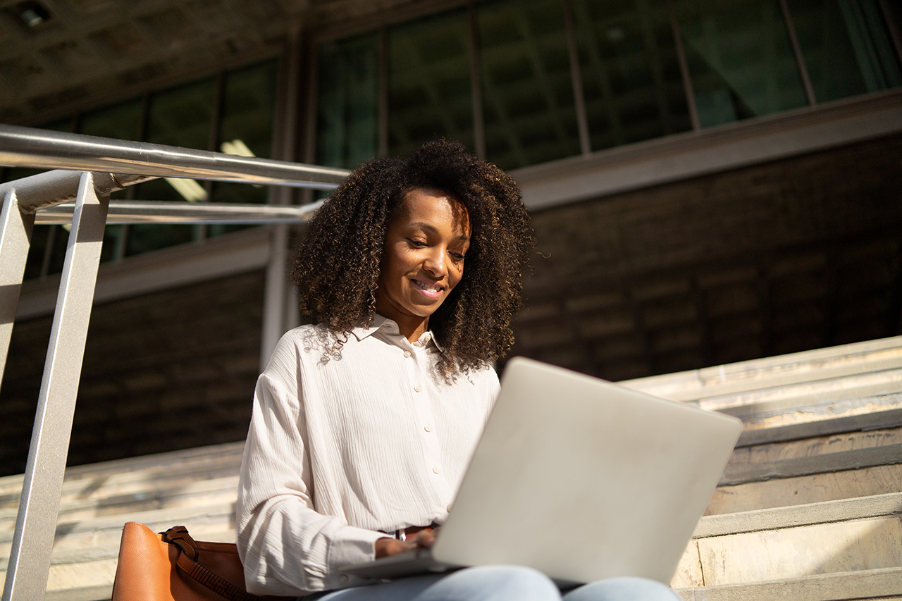women outside on her computer