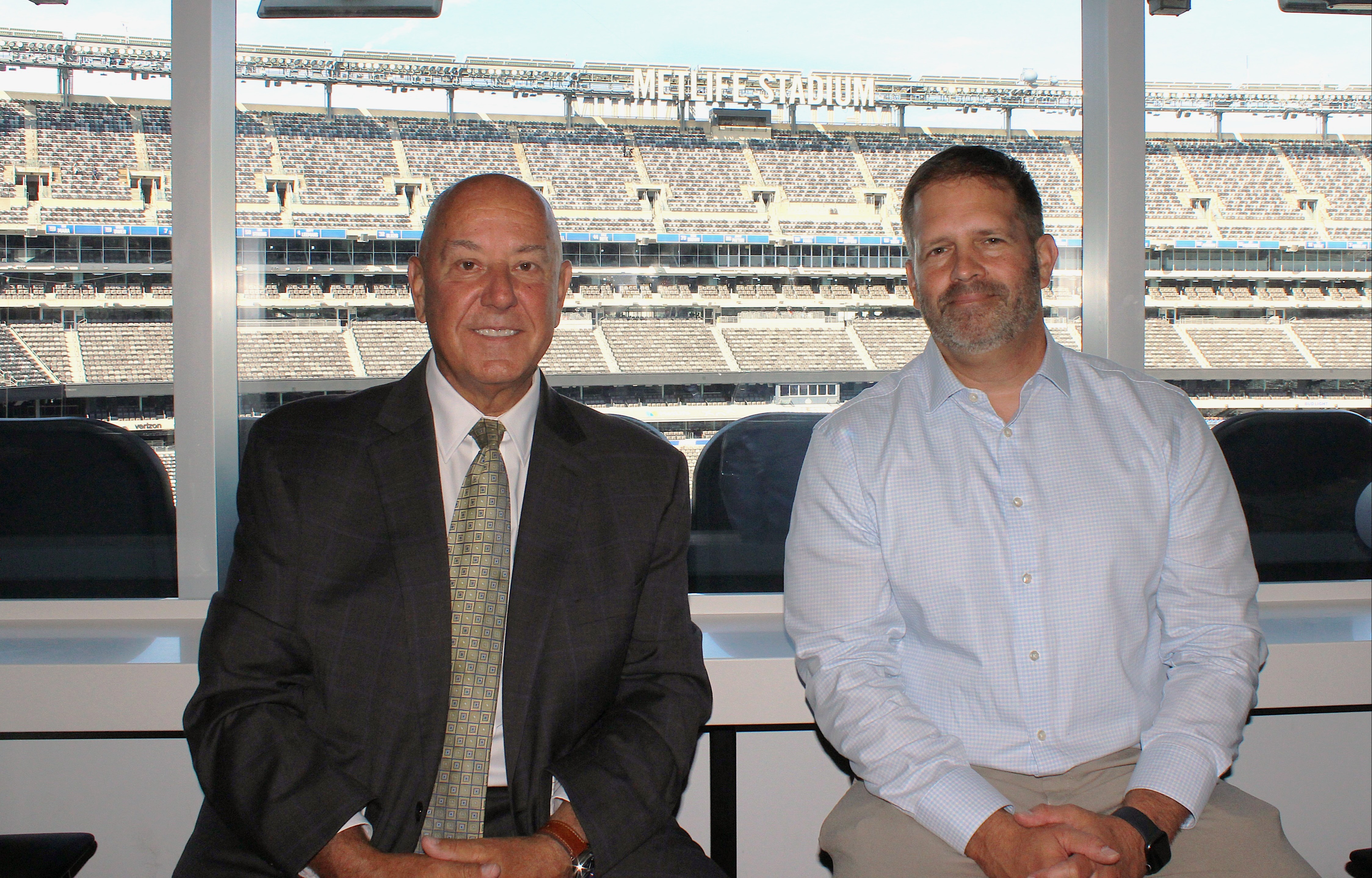 Kearny Bank SVP/Director of Government and Vertical Banking Jack Anastasi (left) with John Willi of Super Football Conference partner Accelerate Sports Ventures during the conference’s recent Media Day event at Met Life Stadium.
